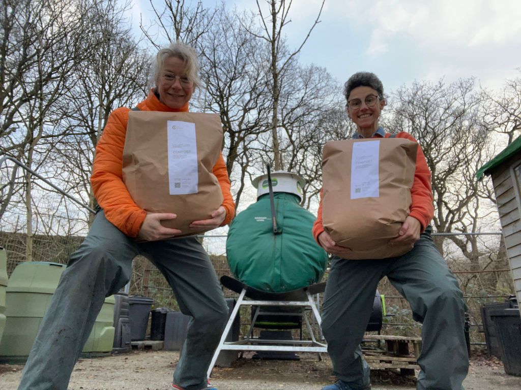 Criw compostio holding bags of soil